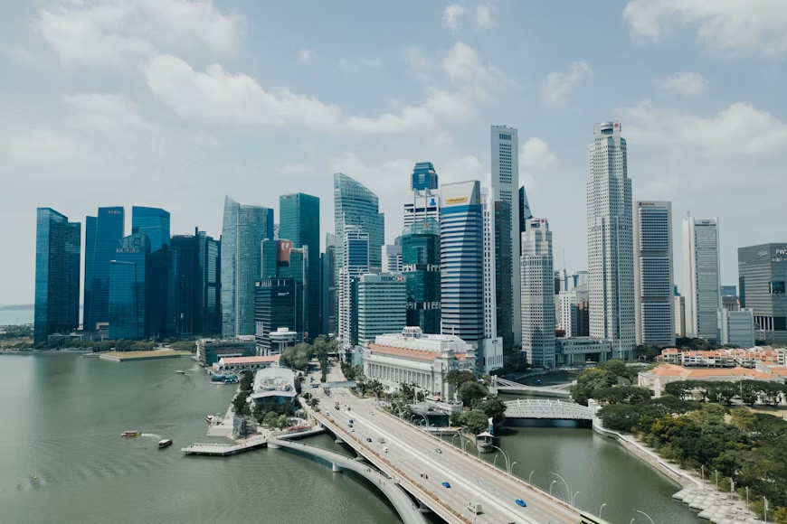 Singapore's Marina Bay business district, the Fullerton Hotel and waterfront bridges