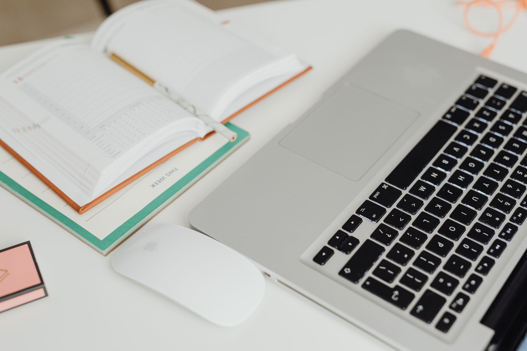 A laptop and planning materials for a business discussion